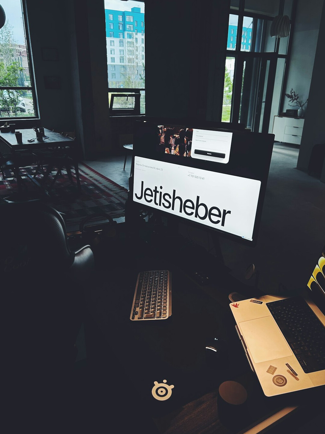 Laptop with programming code on screen on a wooden desk