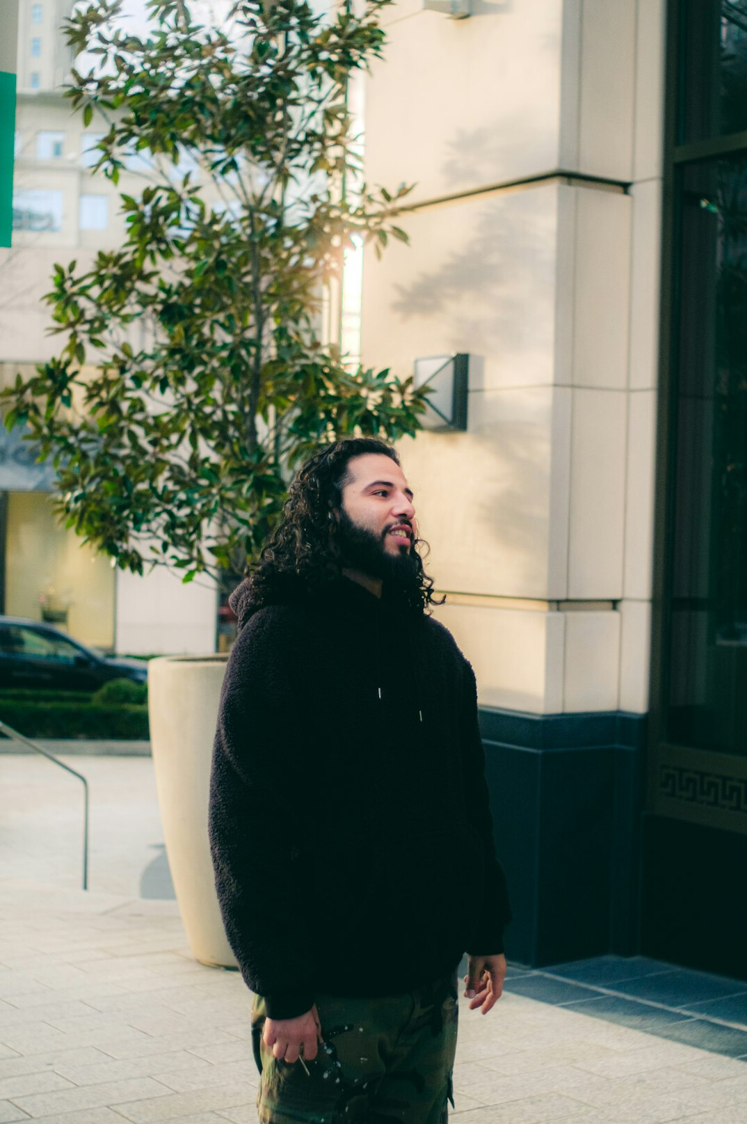 Portrait of a bearded man in dark clothing