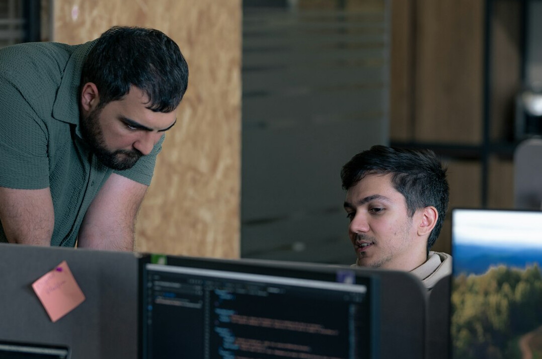 team of programmers collaborating in office